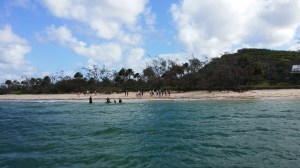 Students on the beach in front of NKIEEC